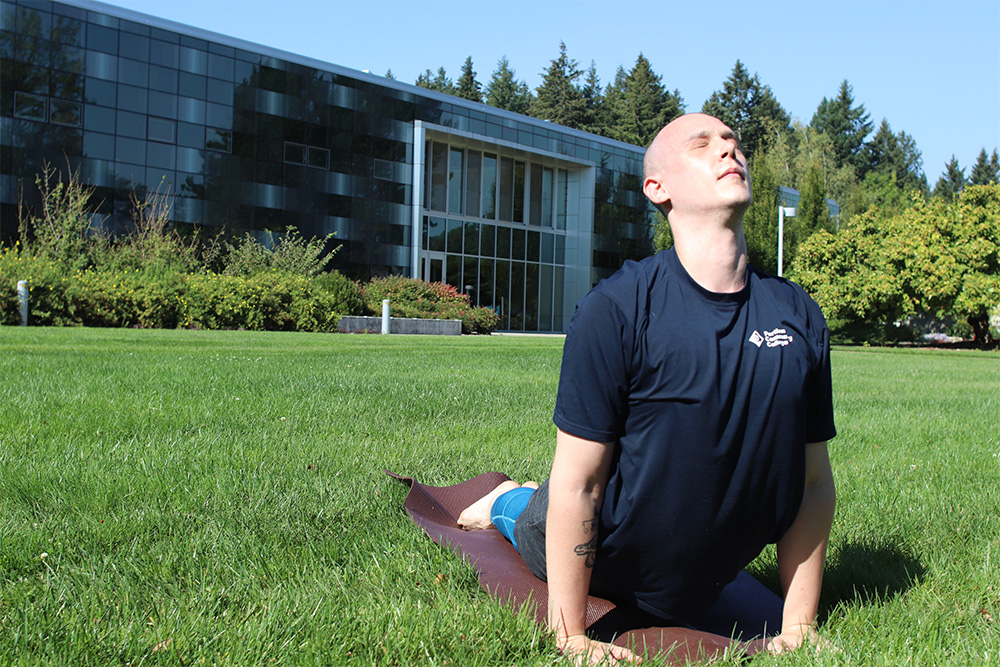 Instructor doing yoga outside
