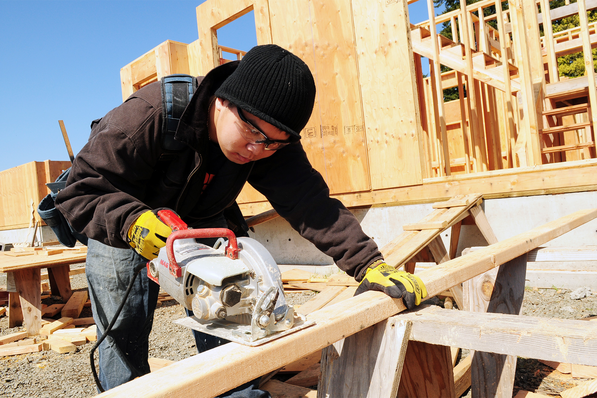 Apprenticeship cutting a wall stud