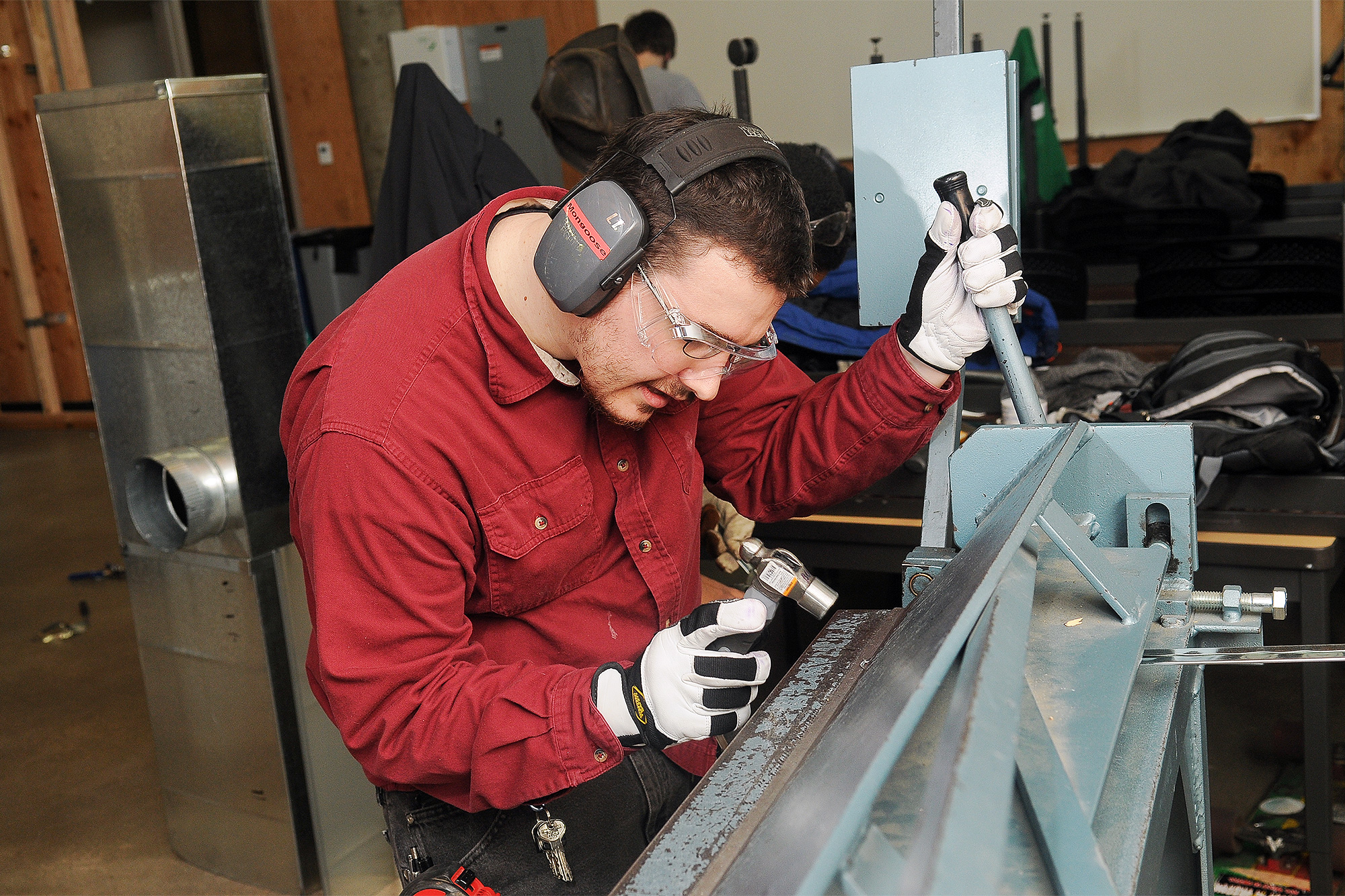 Apprenticeship student working with facilities equipment