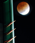 Photograph of a building and the moon