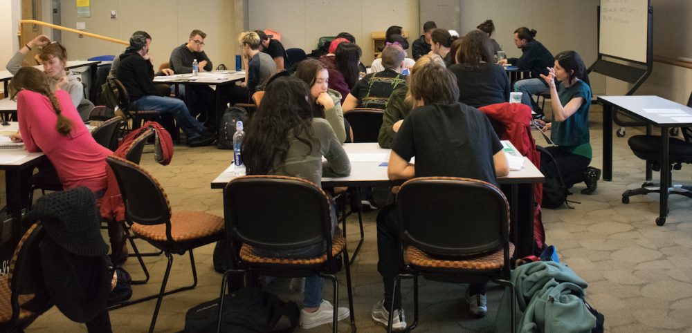 Students working together in an art history classroom