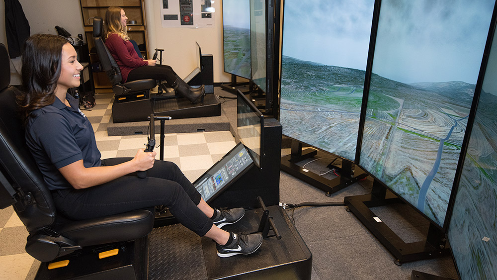 Students using a helicopter flight simulator