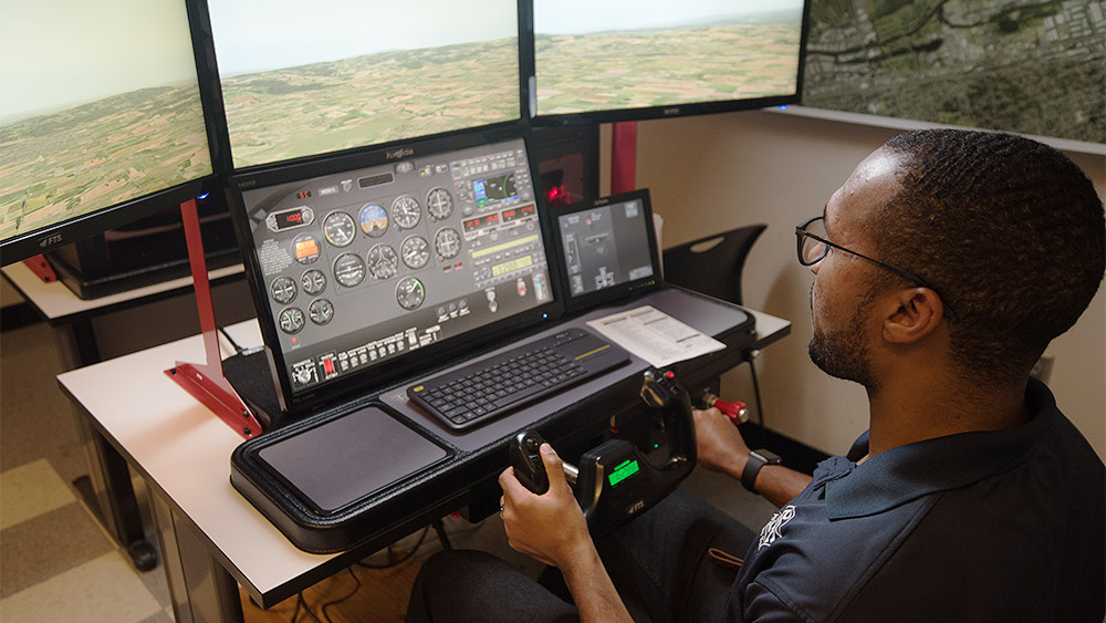 Student using a flight simulator