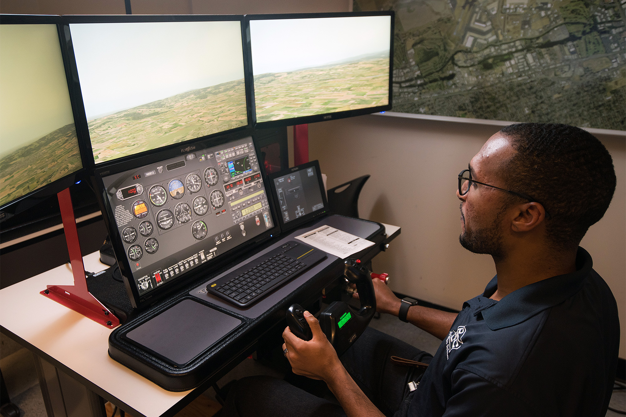 Aviation Science student practicing on the single-pilot flight simulator