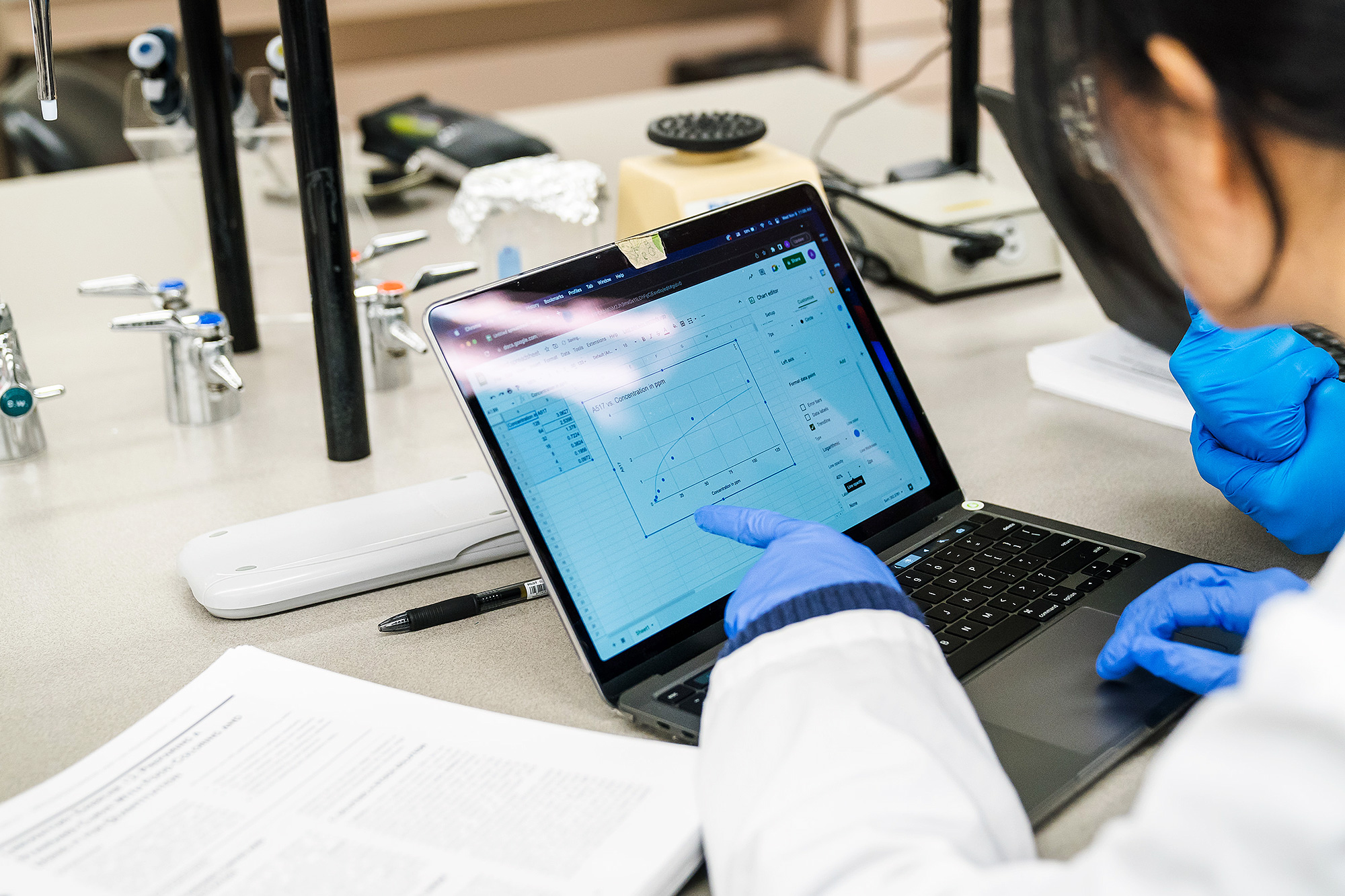 Bioscience Technology student looking at data on a laptop