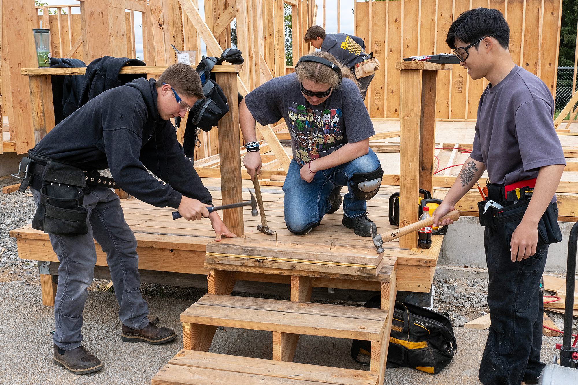 Students hammering and framing a wall