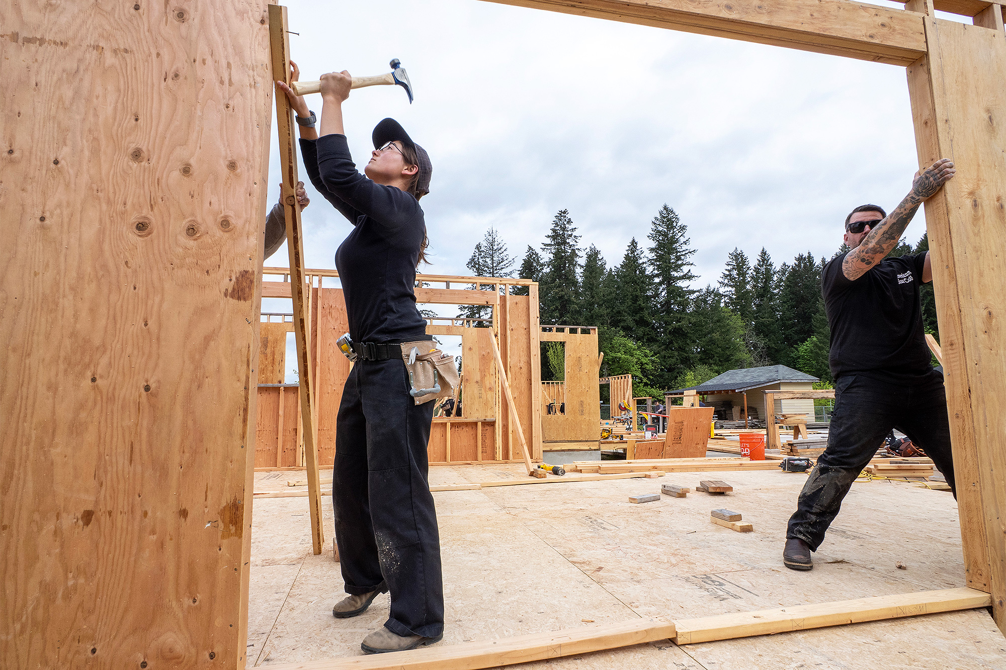 Students framing a wall
