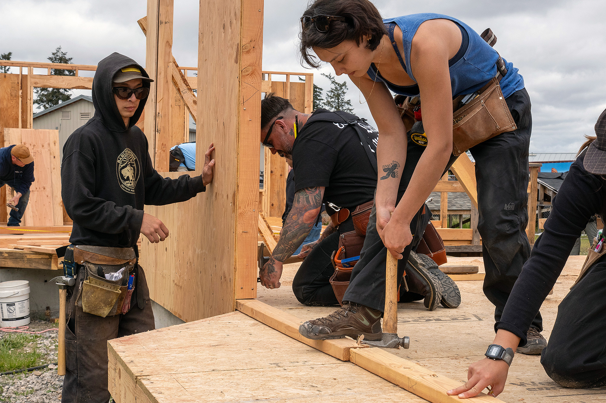 Students framing a wall together