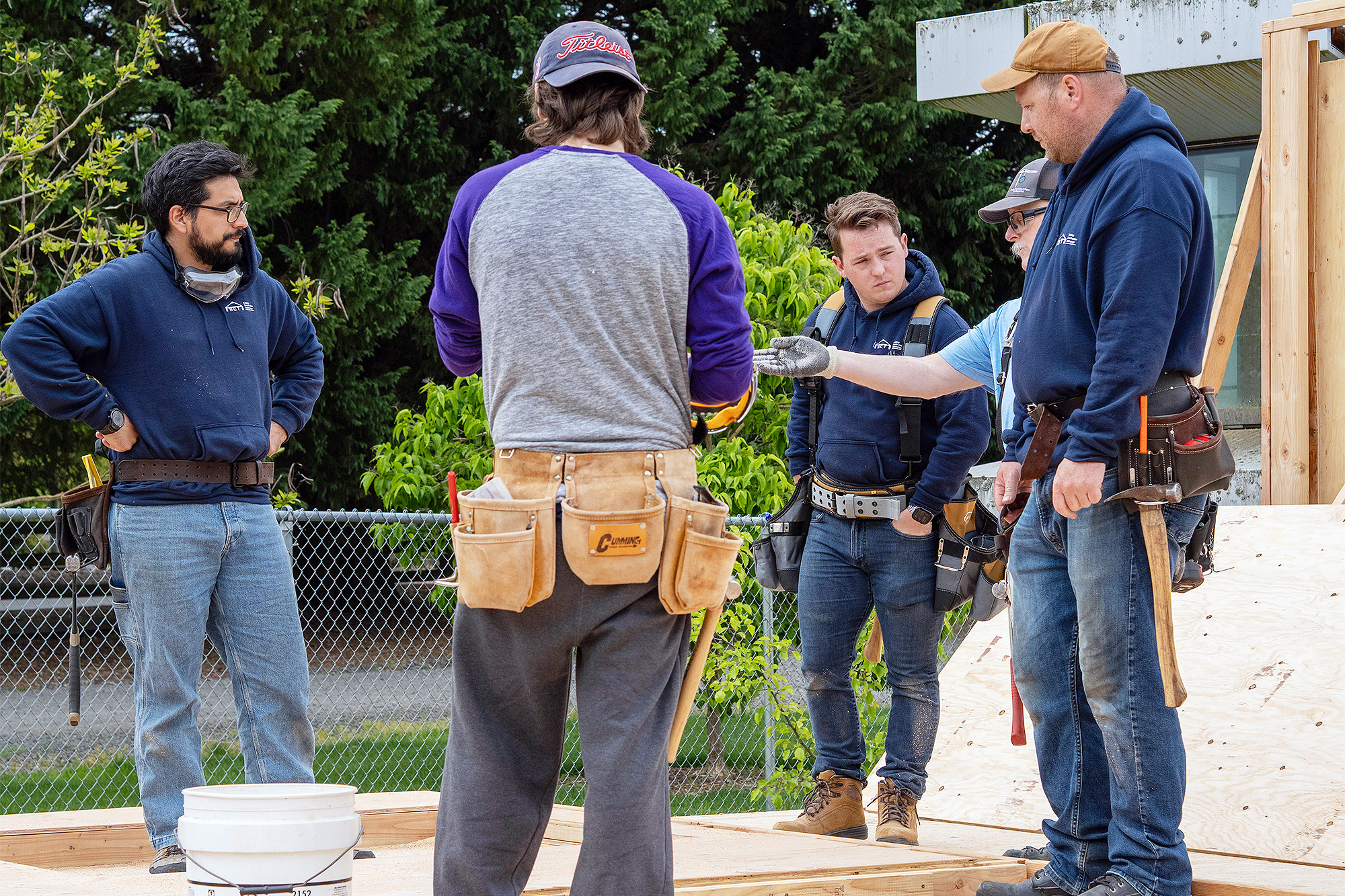 Building Inspection instructor talking to a students at a job site