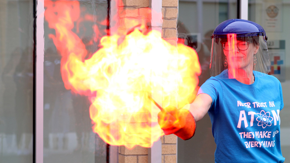 woman creating big fire ball