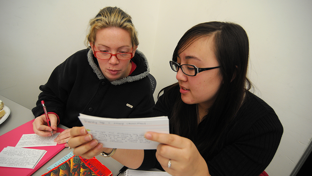 Students reading notecards together