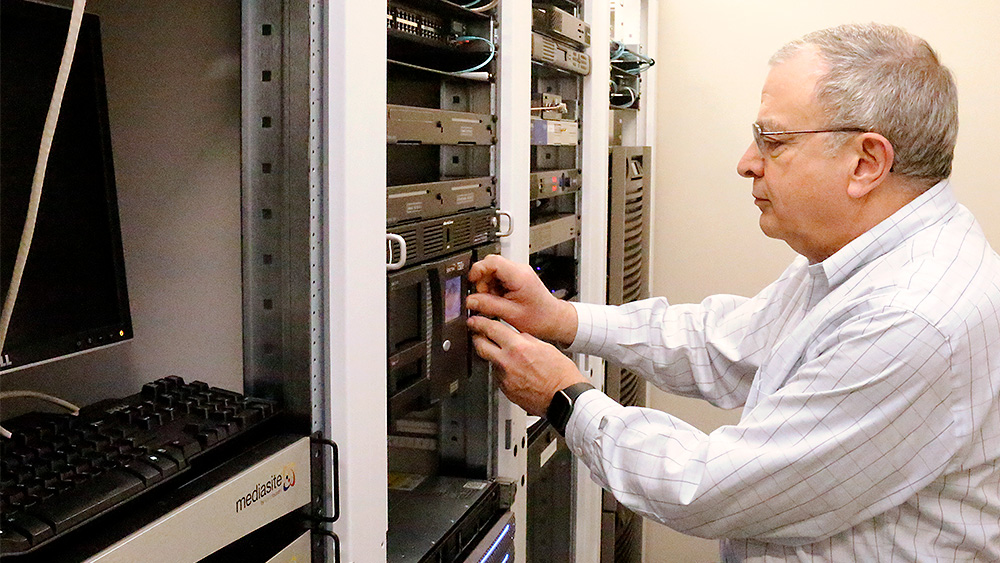 Instructor working with a server bank