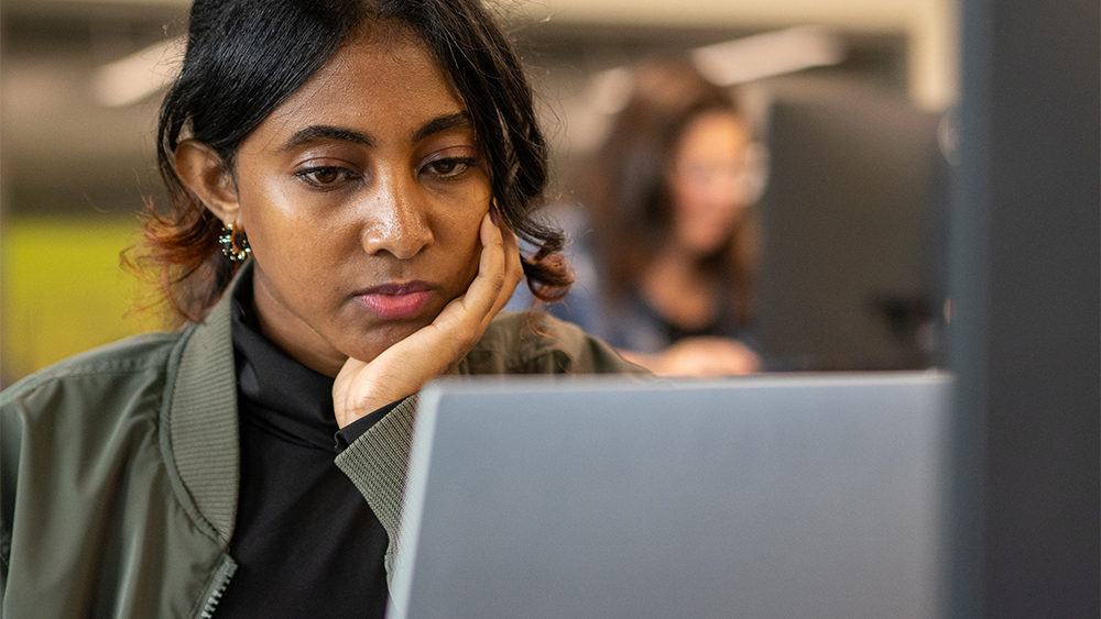 Student working on a laptop in class
