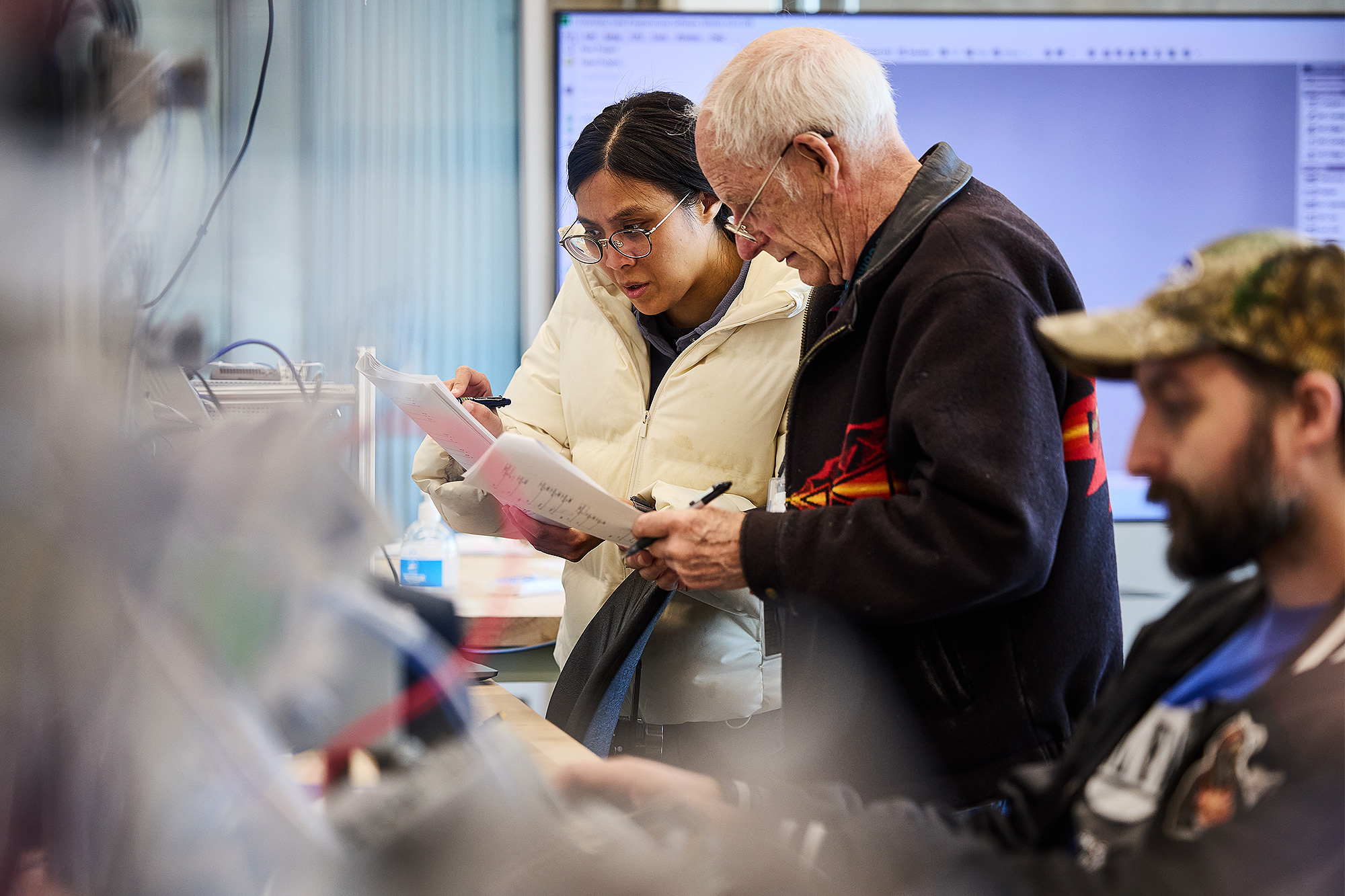 Network administration instructor working with a student in class