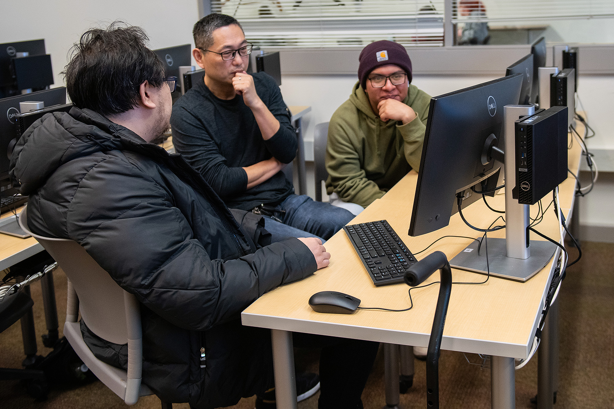Students talking together in a Computer Information Systems class