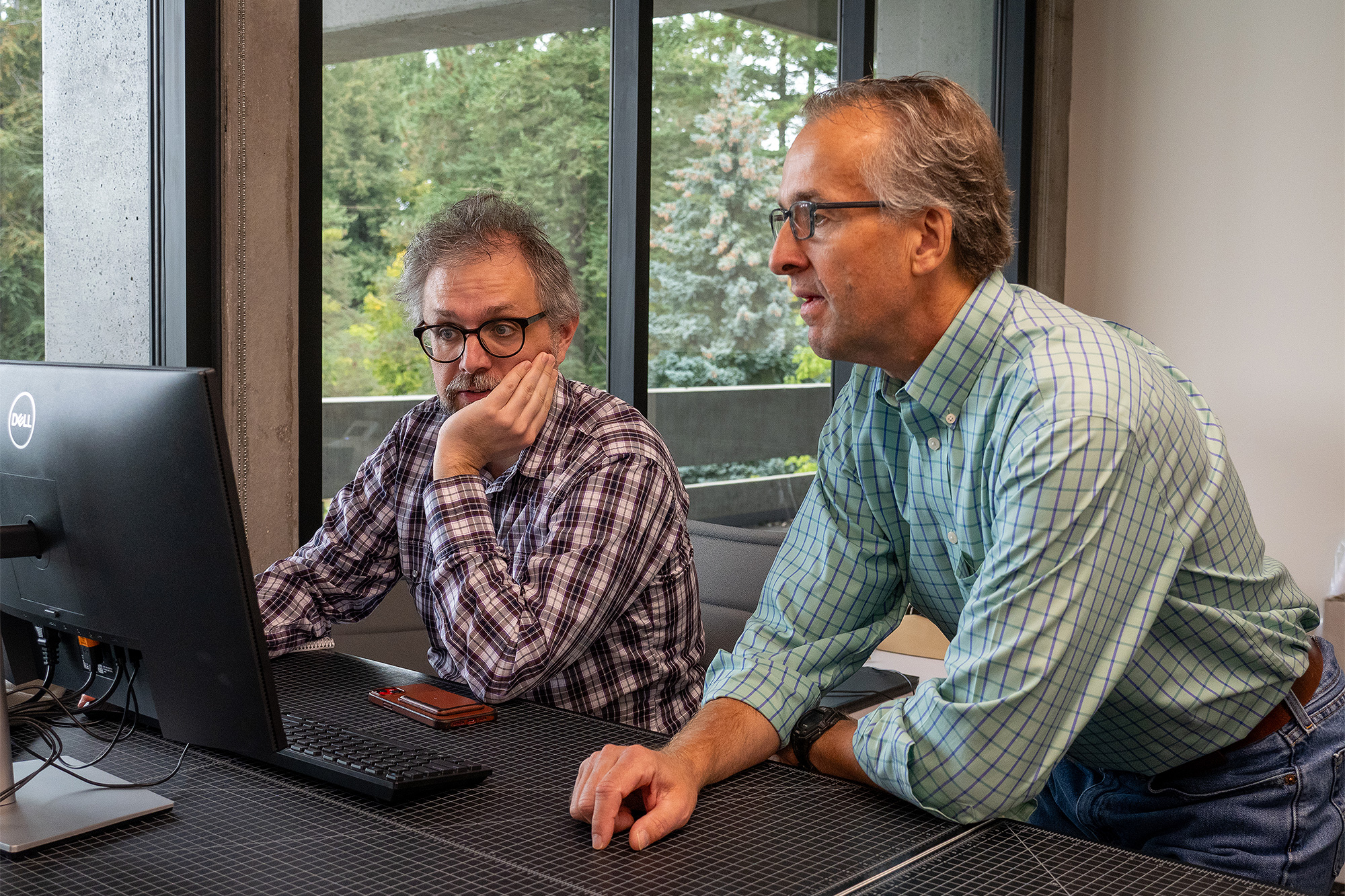 Instructor assisting a student in a Computer Science class