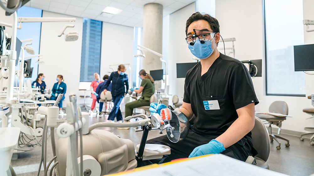 student working at the dental clinic