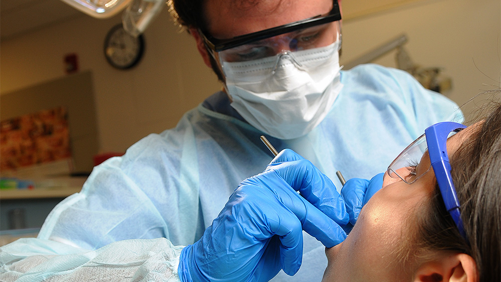 Dental Hygiene student working with a patient