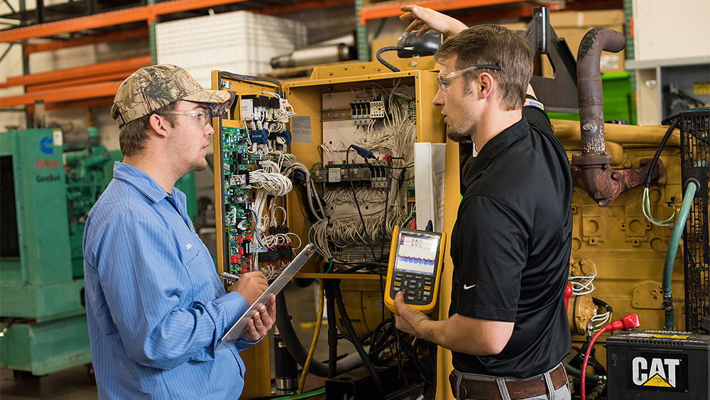 Student and instructor working with an electrical panel