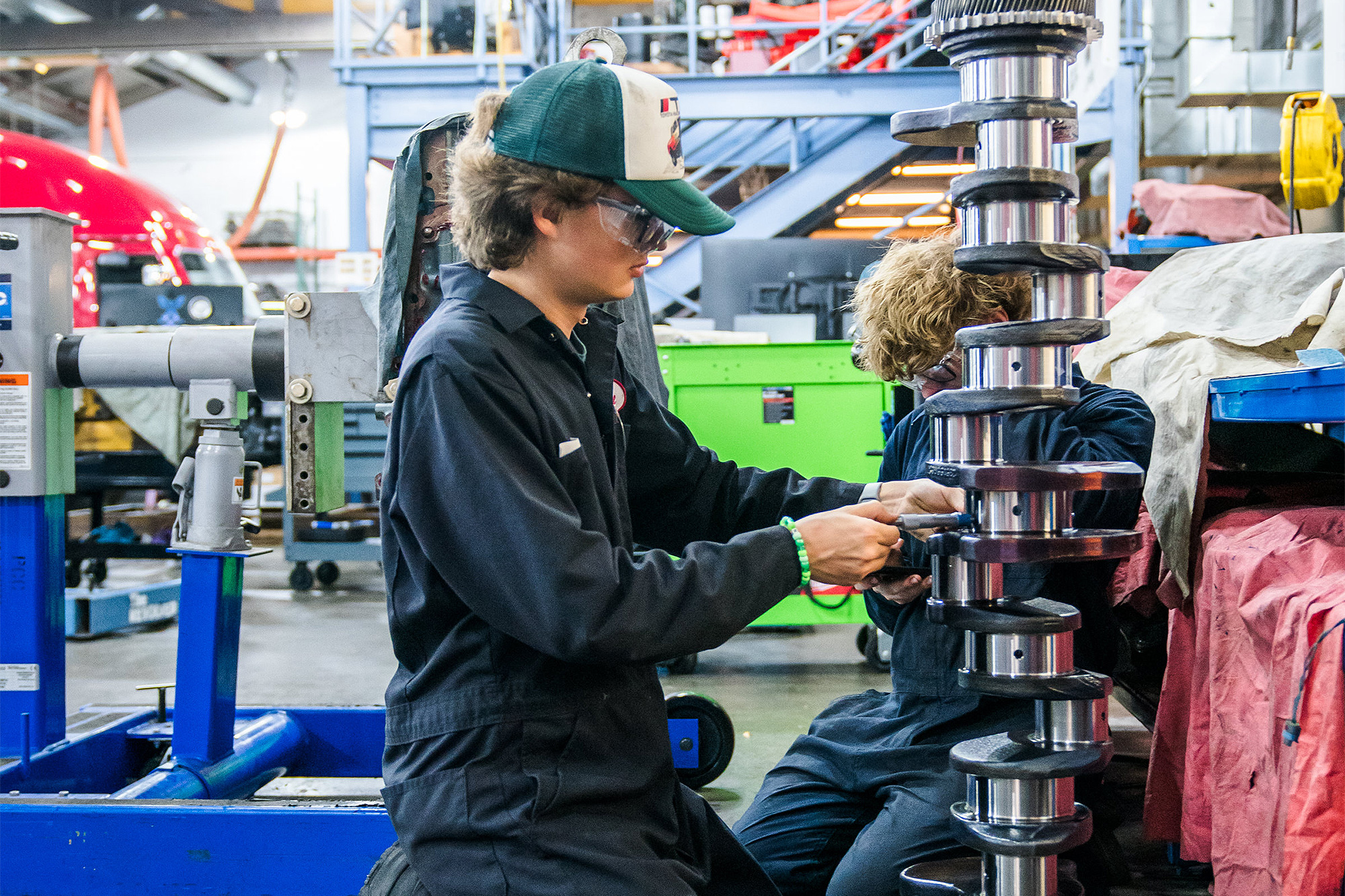 Diesel Service student working on a large part in the shop