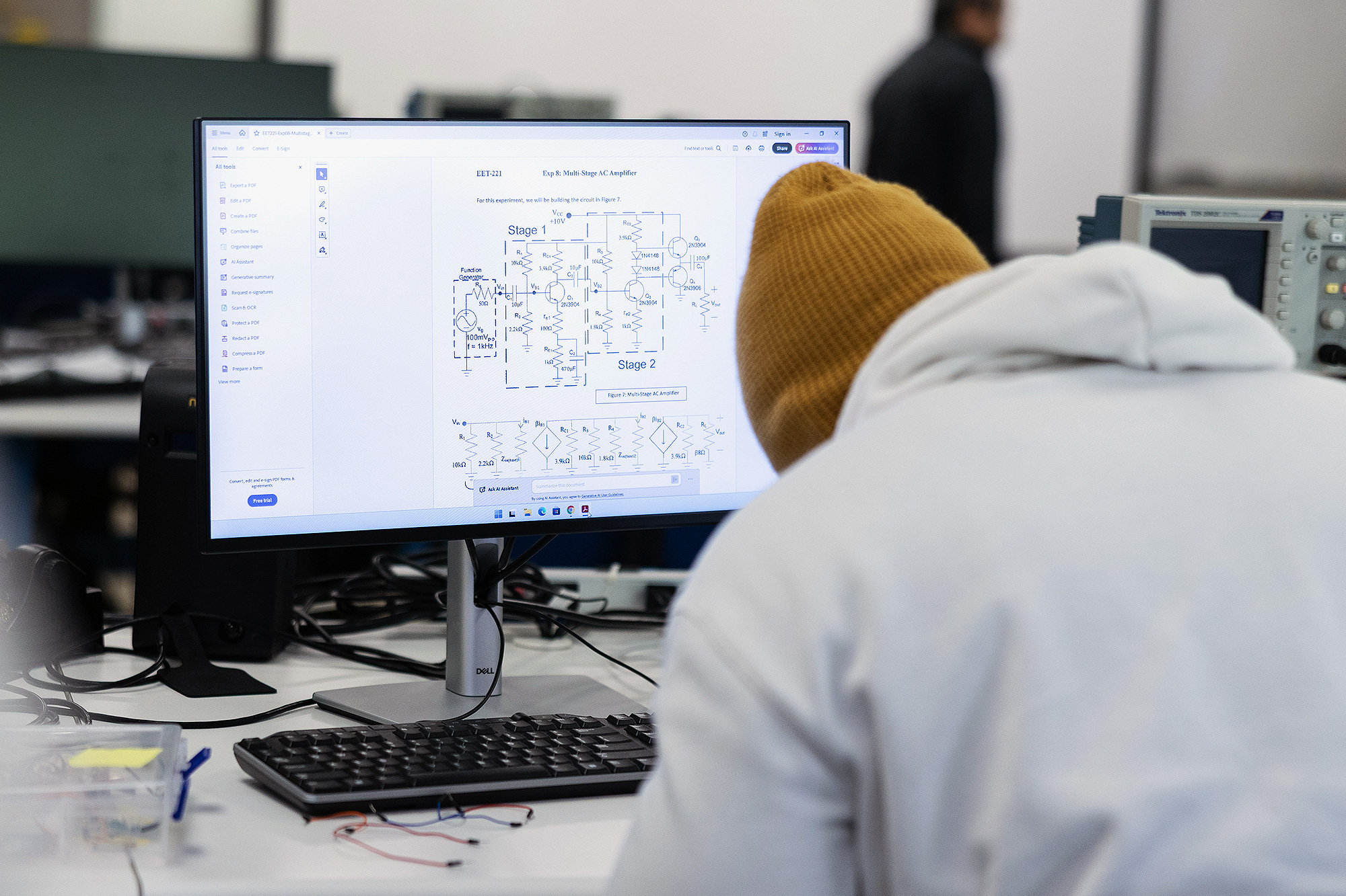 View of a diagram on an Electronic Engineering Technology student's computer screen while he works in the lab