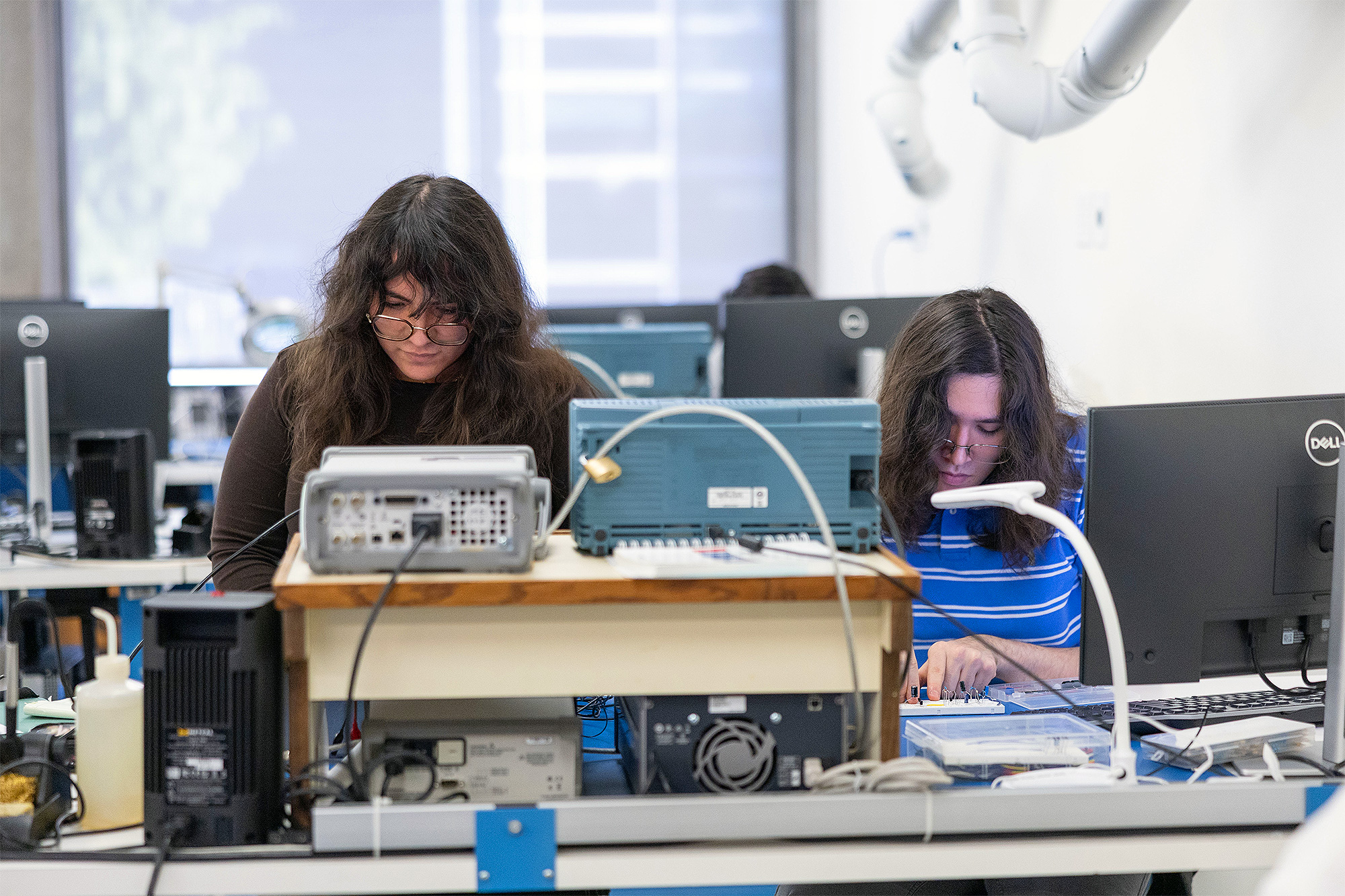 Electronic Engineering Technology students working in the EET lab