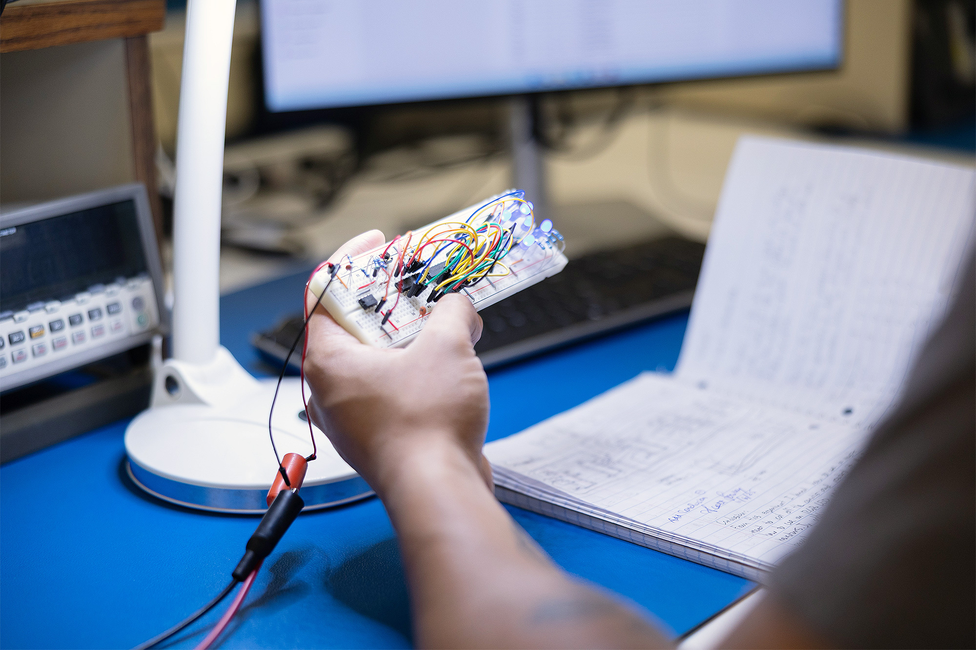 Closeup of an Electronic Engineering Technology student's circuit work in the EET lab