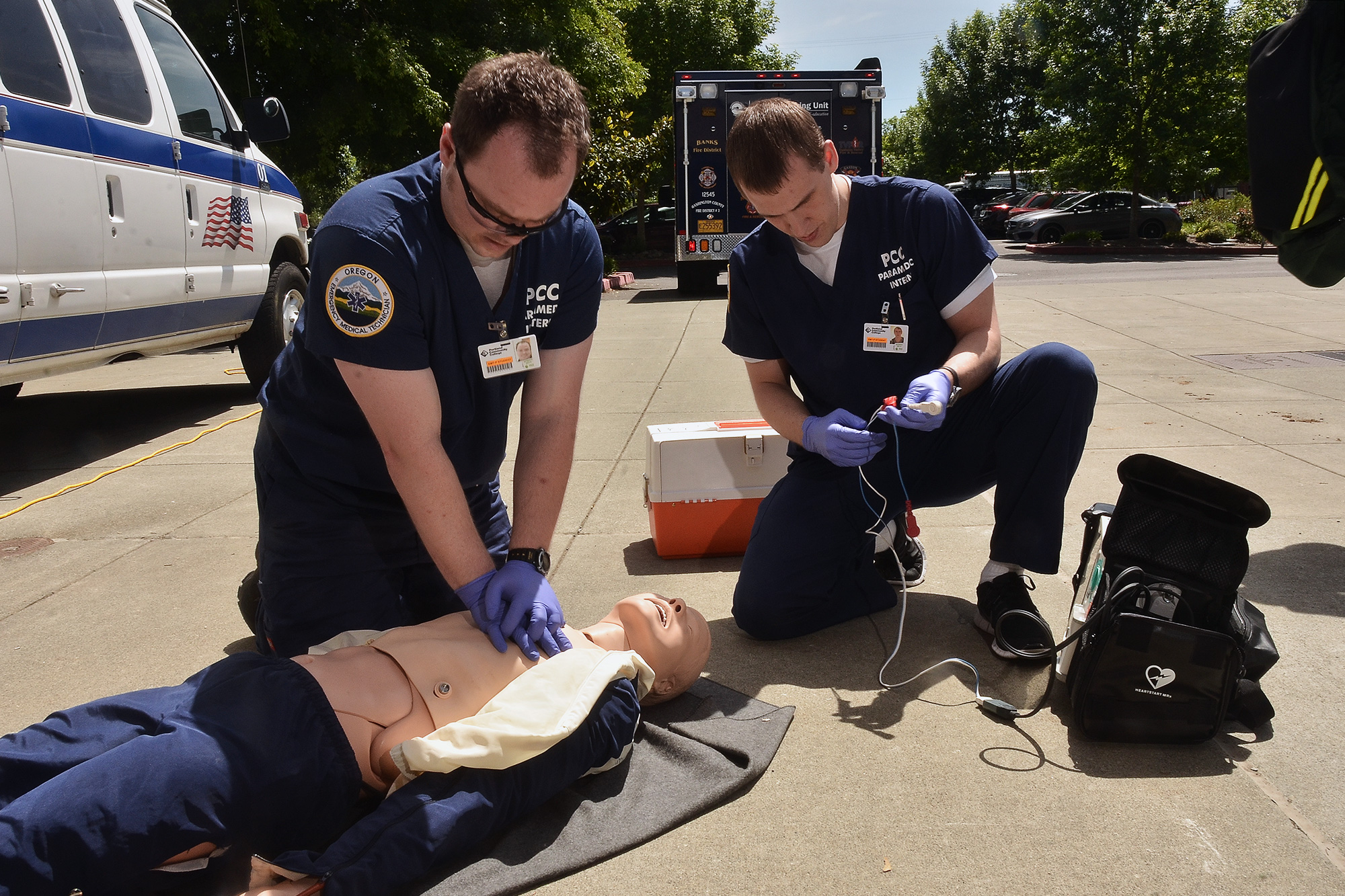 EMS Paramedic students performing CPR on a dummy patient