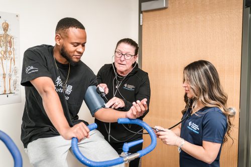 Checking a student's blood pressure