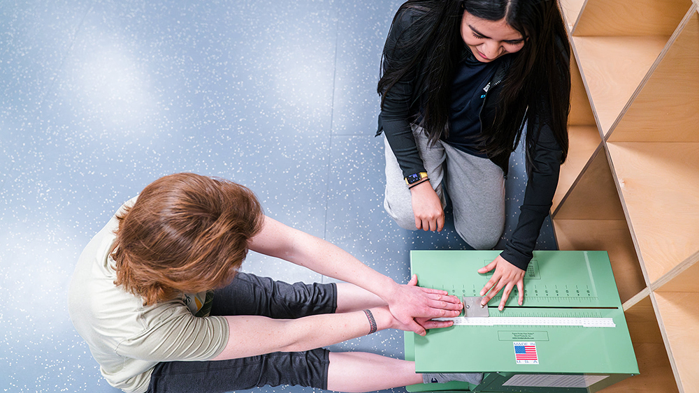 Exercise science students measuring flexibility