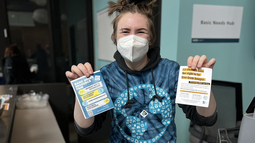 Student helping with basic needs sign ups