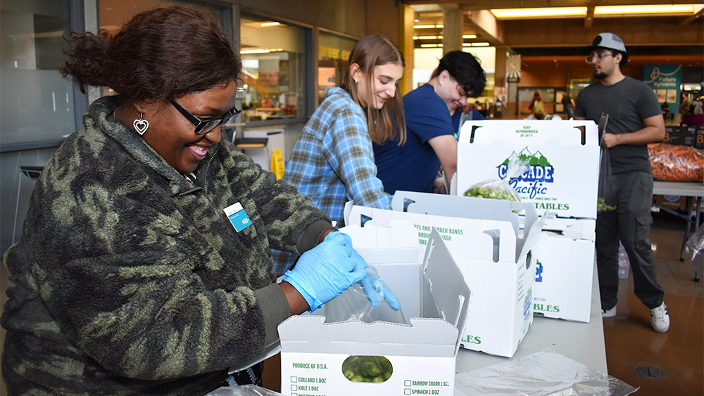 Students working at a campus food bank event