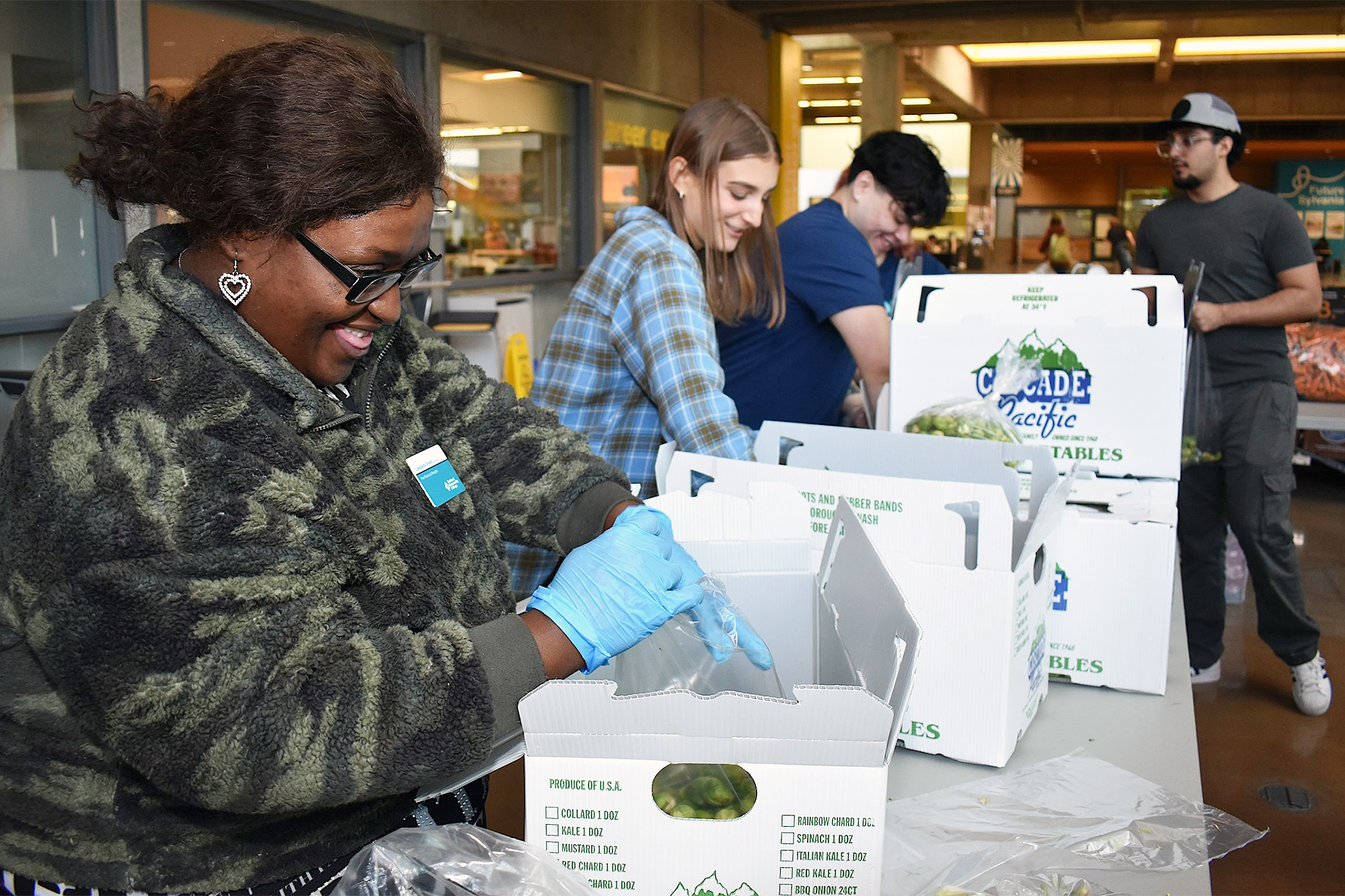 Family and Human Services students working at a campus food bank event