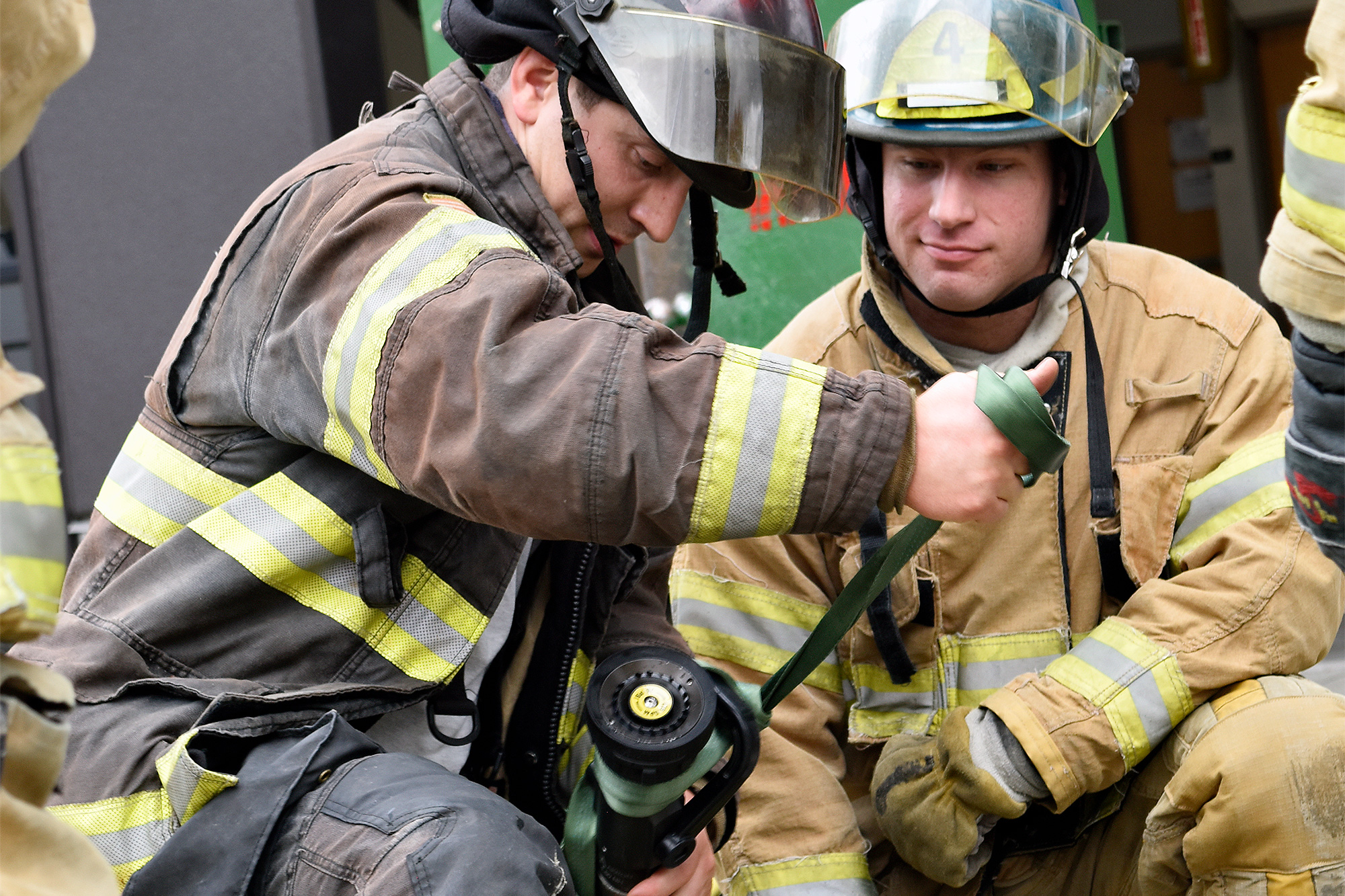 Fire Protection students setting up a water hose