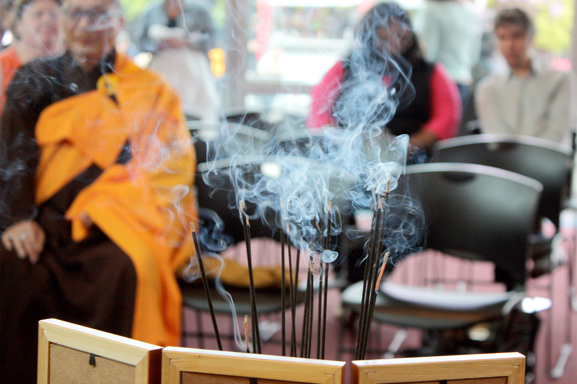 Closeup of incense burning at a PCC event