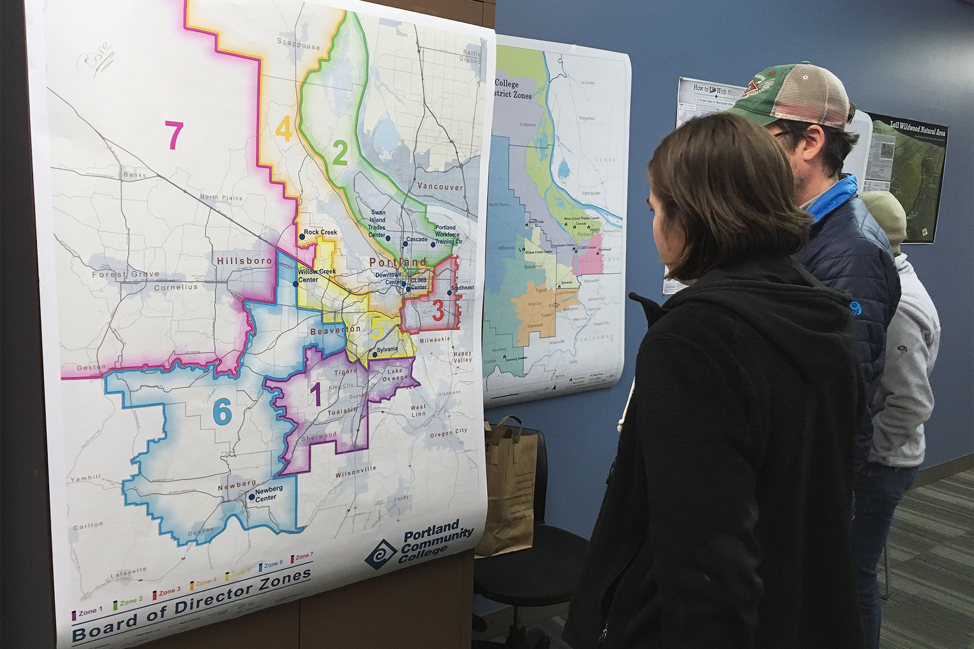 Geography students looking at a GIS map of Portland