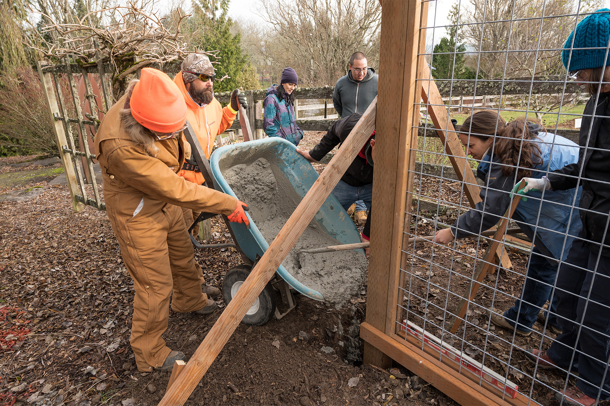 Landscape Tech students pouring concrete for a post