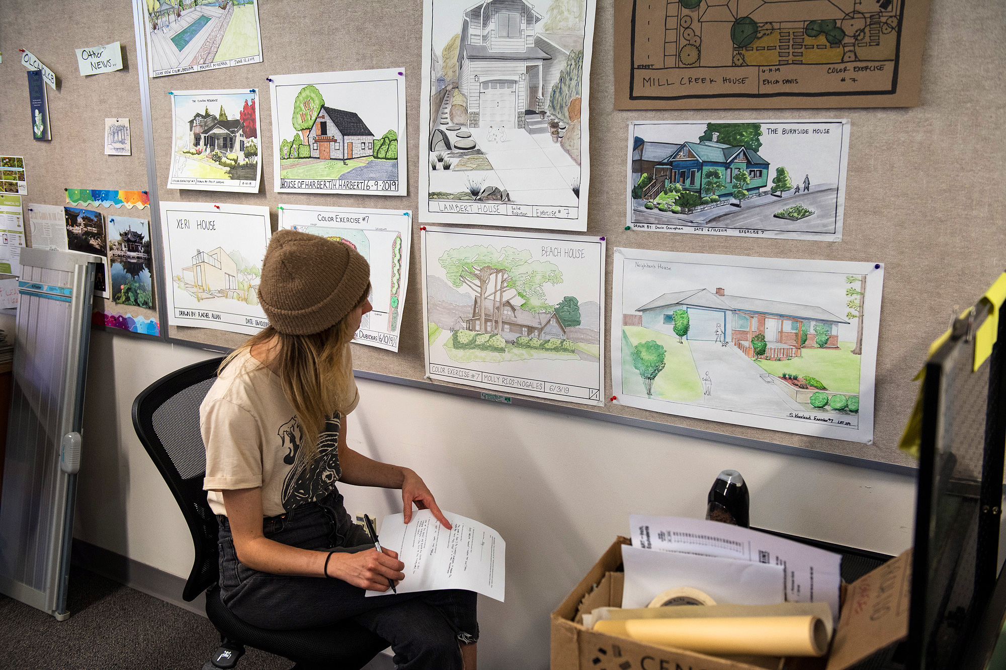 Landscape Tech design student looking at landscape concept drawings