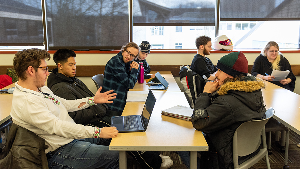 Students talking together in a creative writing class