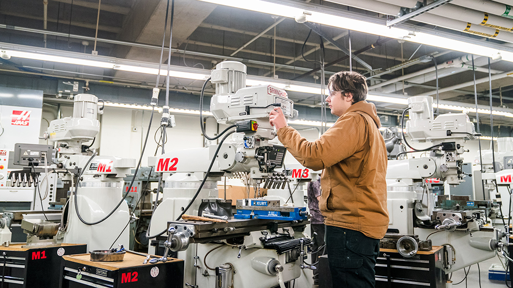 Student using a CNC machine in the lab