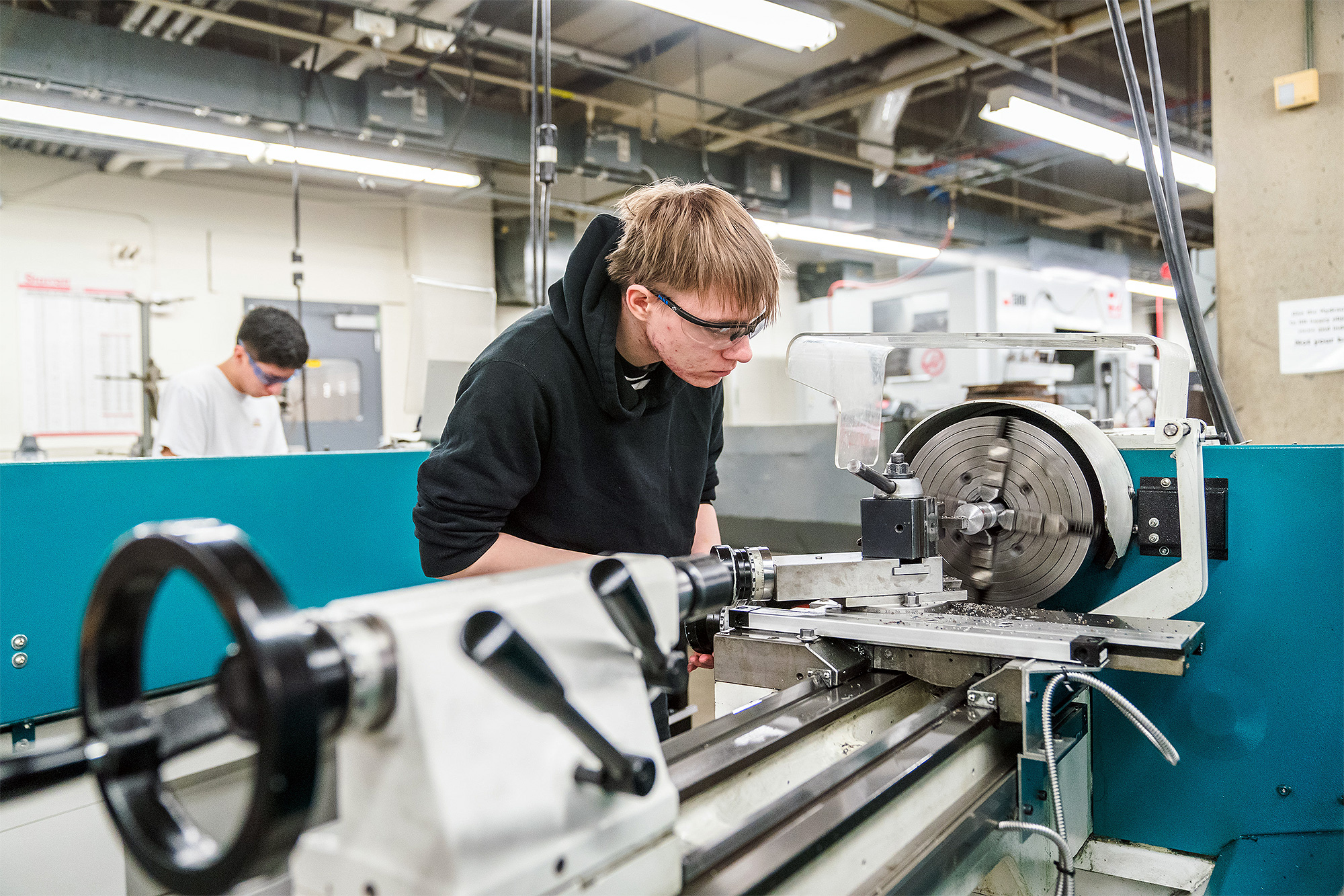 Machine Manufacturing student using a CNC turning machine
