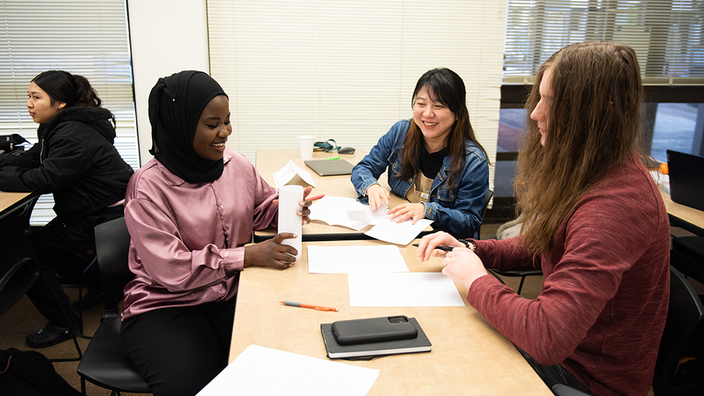 Marketing students working together in class