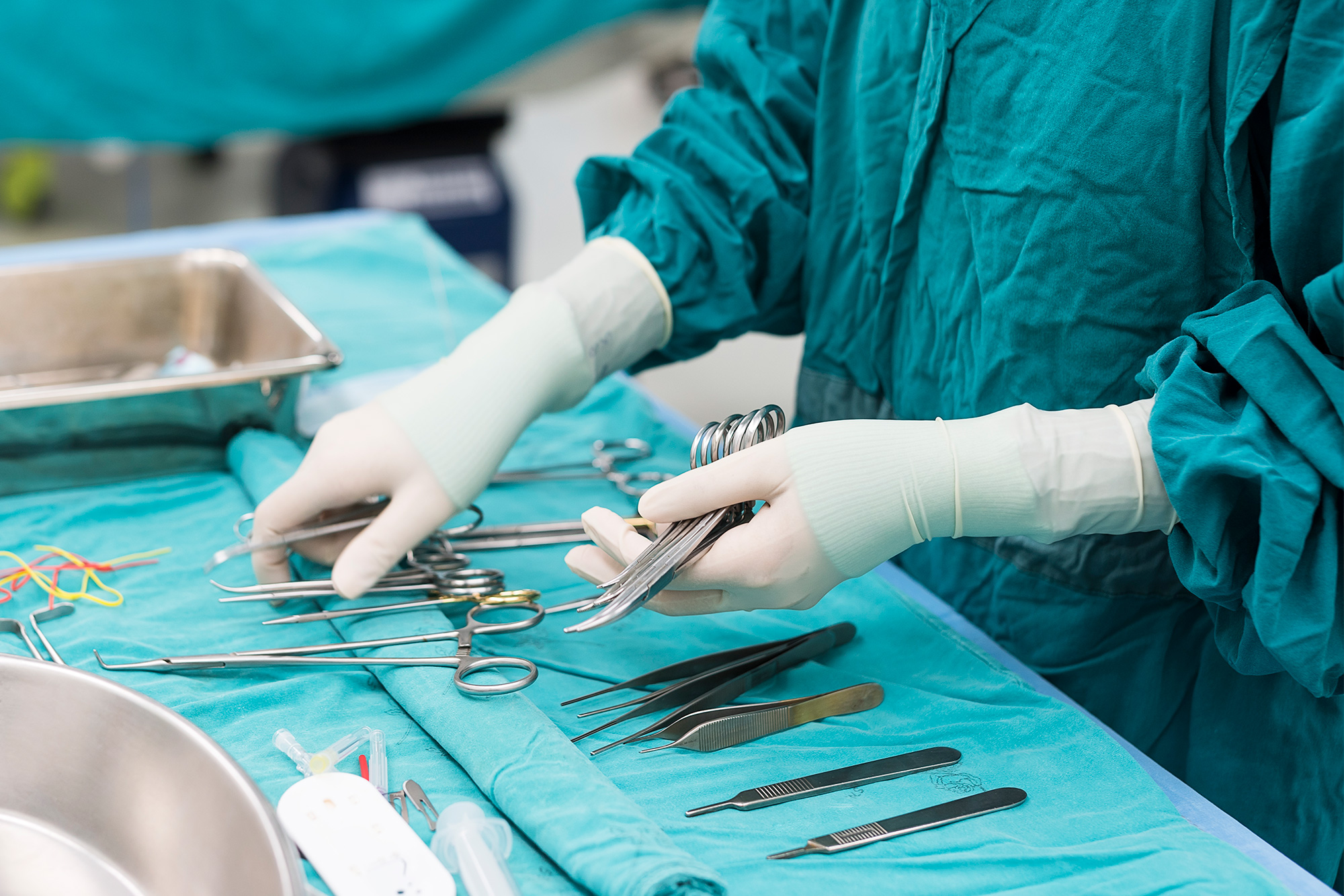 Sterile Processing Technician student sorting instruments on a table