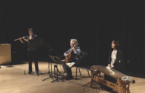 Three music students performing together