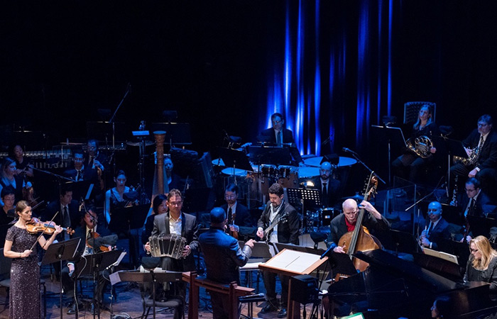 John Mery playing during an orchestra performance