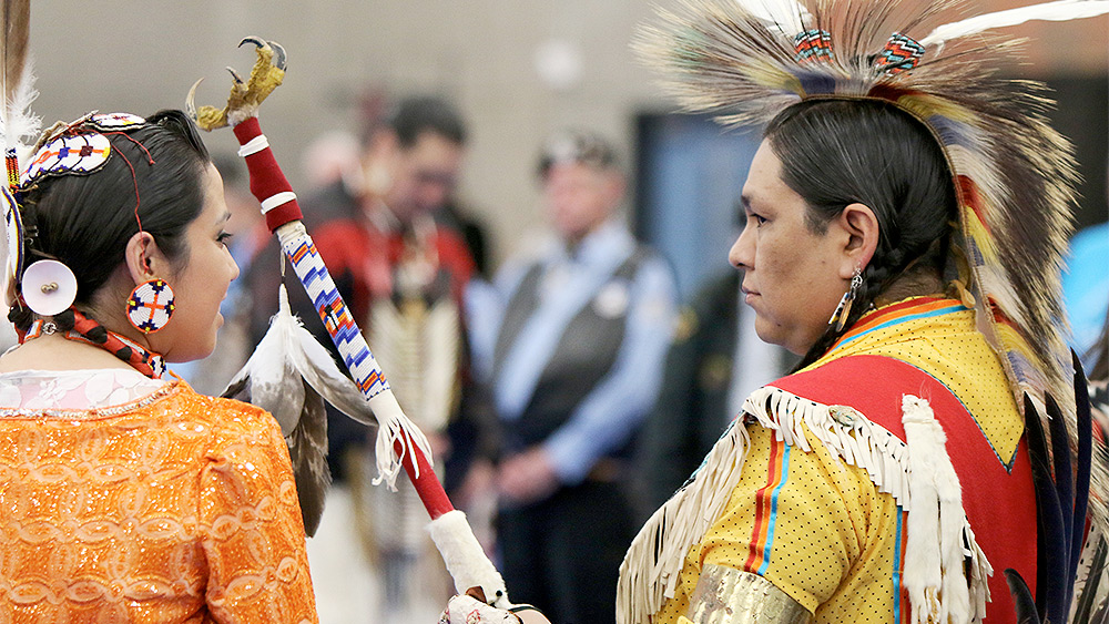 Native dancers in costume at PCC's annual powwow