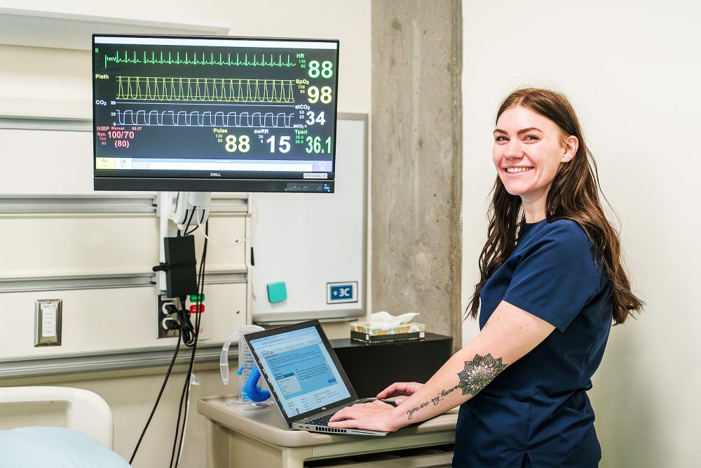 Nursing Assistant student working at a computer