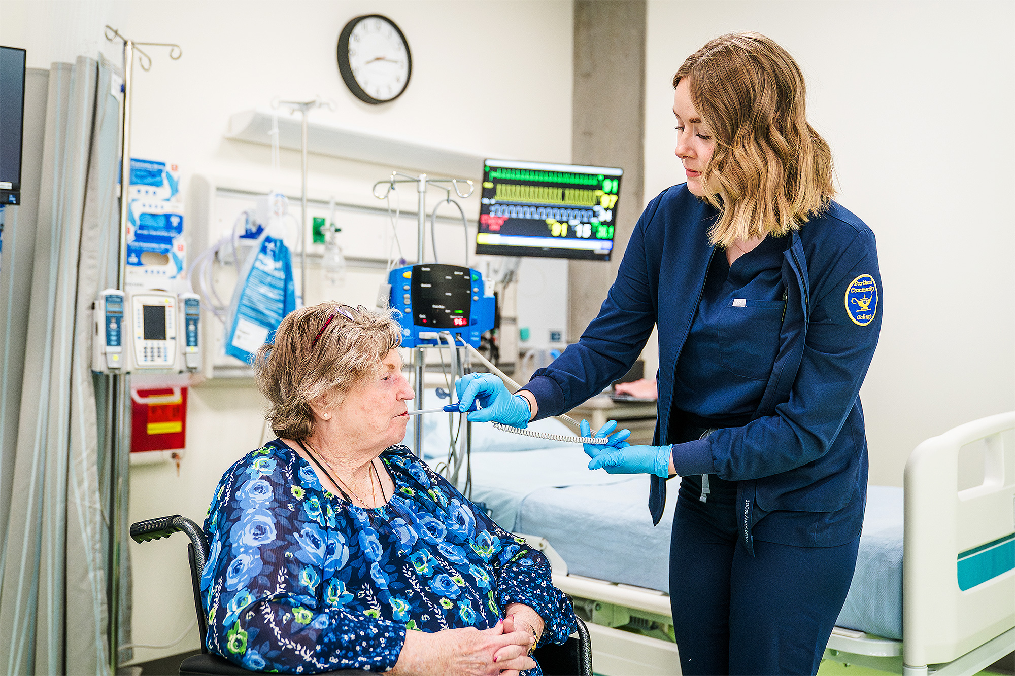 Nursing Assistant student taking a patient's temperature