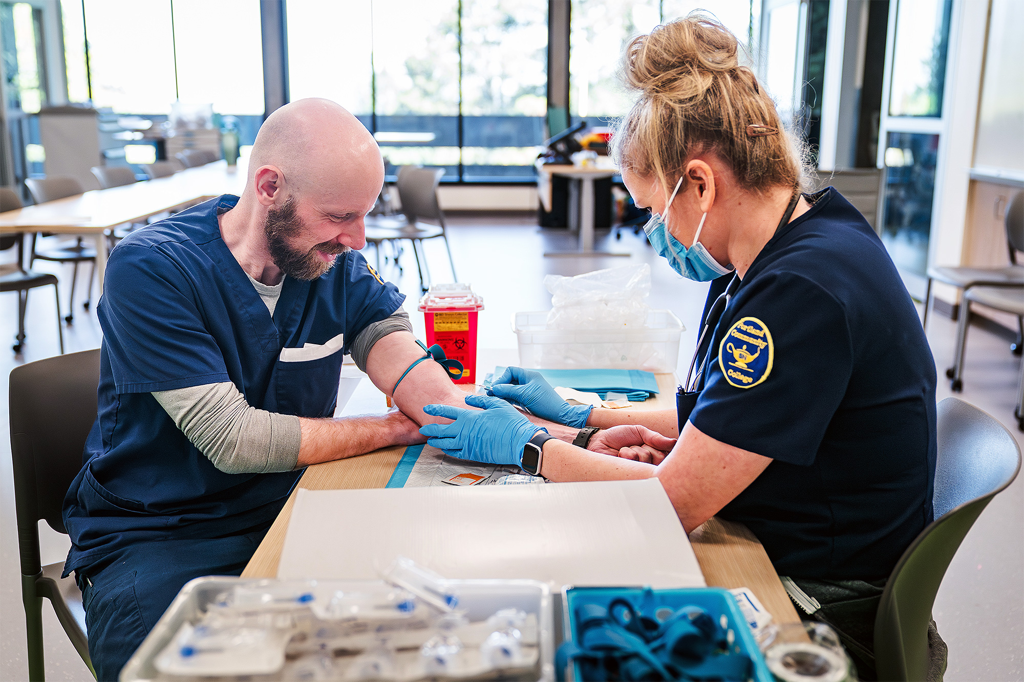 Nursing students drawing blood