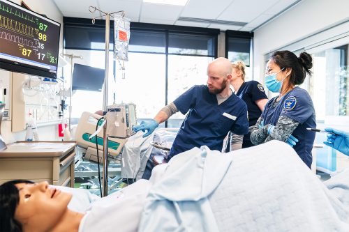 Nursing students looking at a patient's monitor
